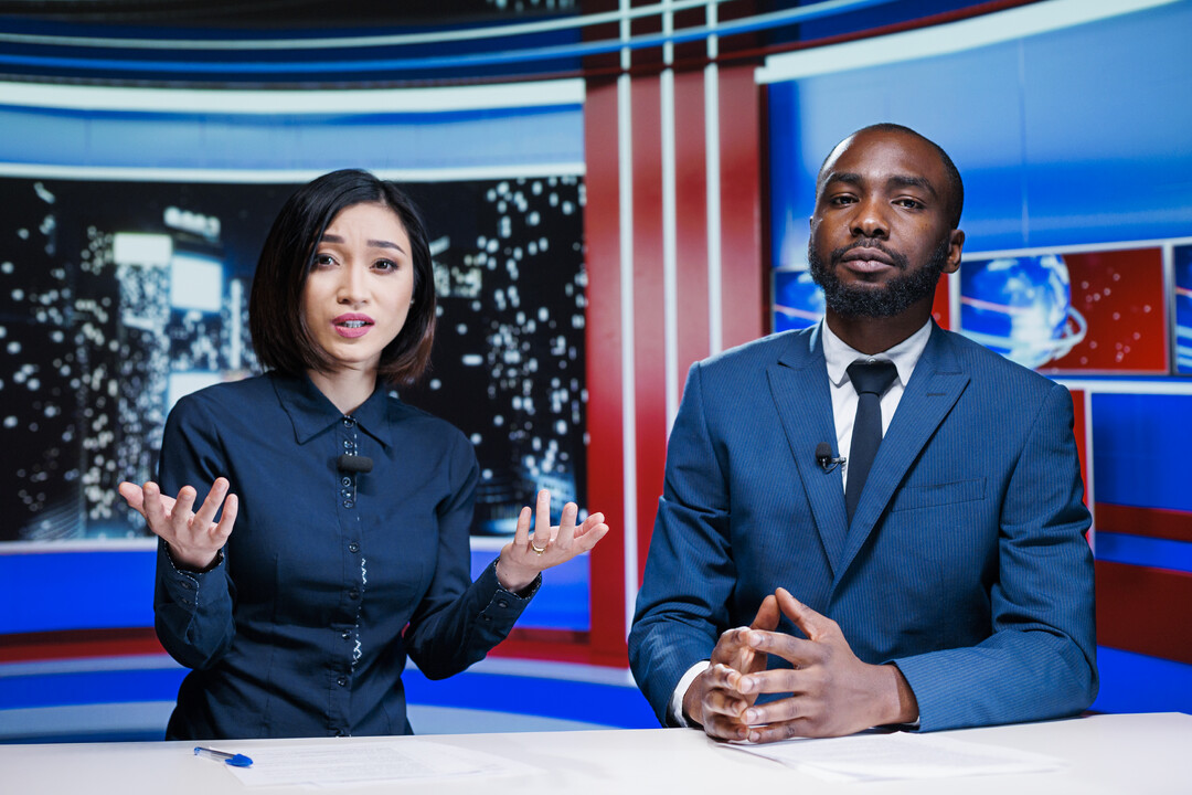 Media Don'ts: Two news anchors looking confused and annoyed